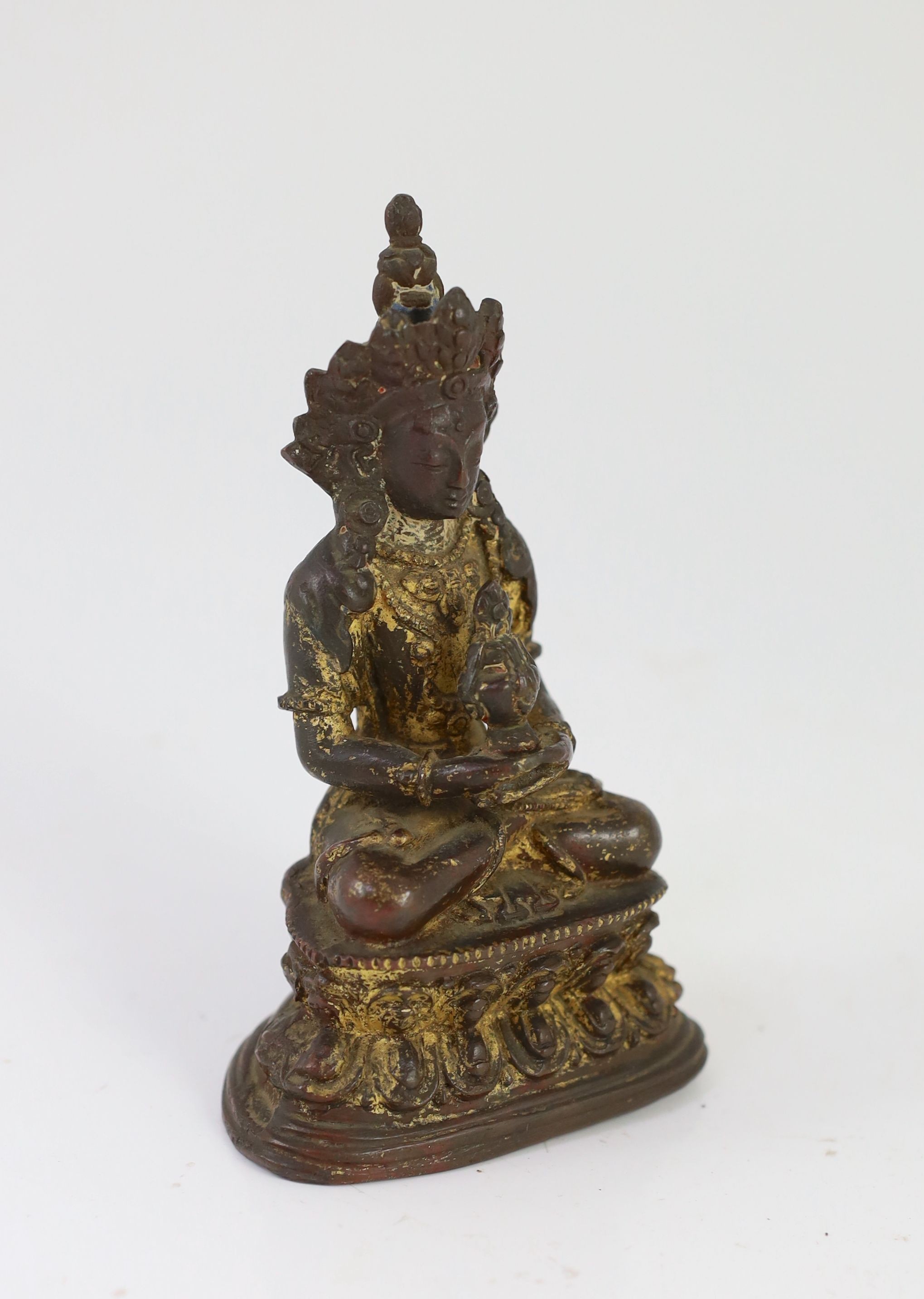 A Tibetan gilt copper alloy figure of Amitayus, 16th/17th century, 14cm high